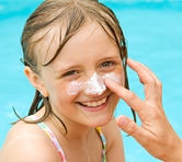 Girl with sunscreen on her nose