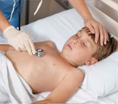 Boy lying on stretcher